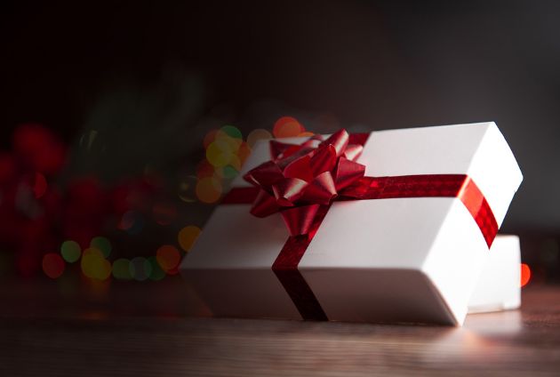 White present wrapped in a red ribbon