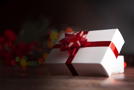 White present wrapped in a red ribbon